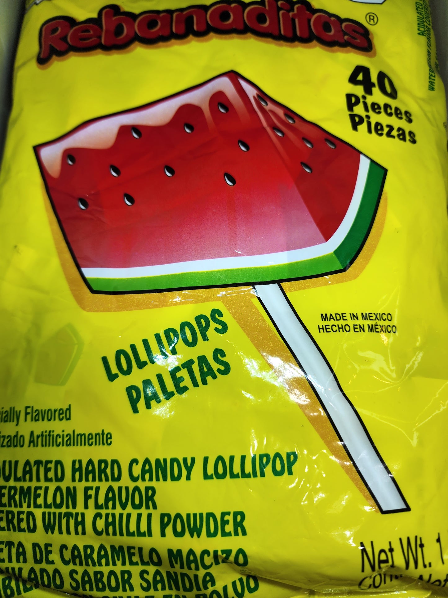 Watermelon lollipops covered with chili powder