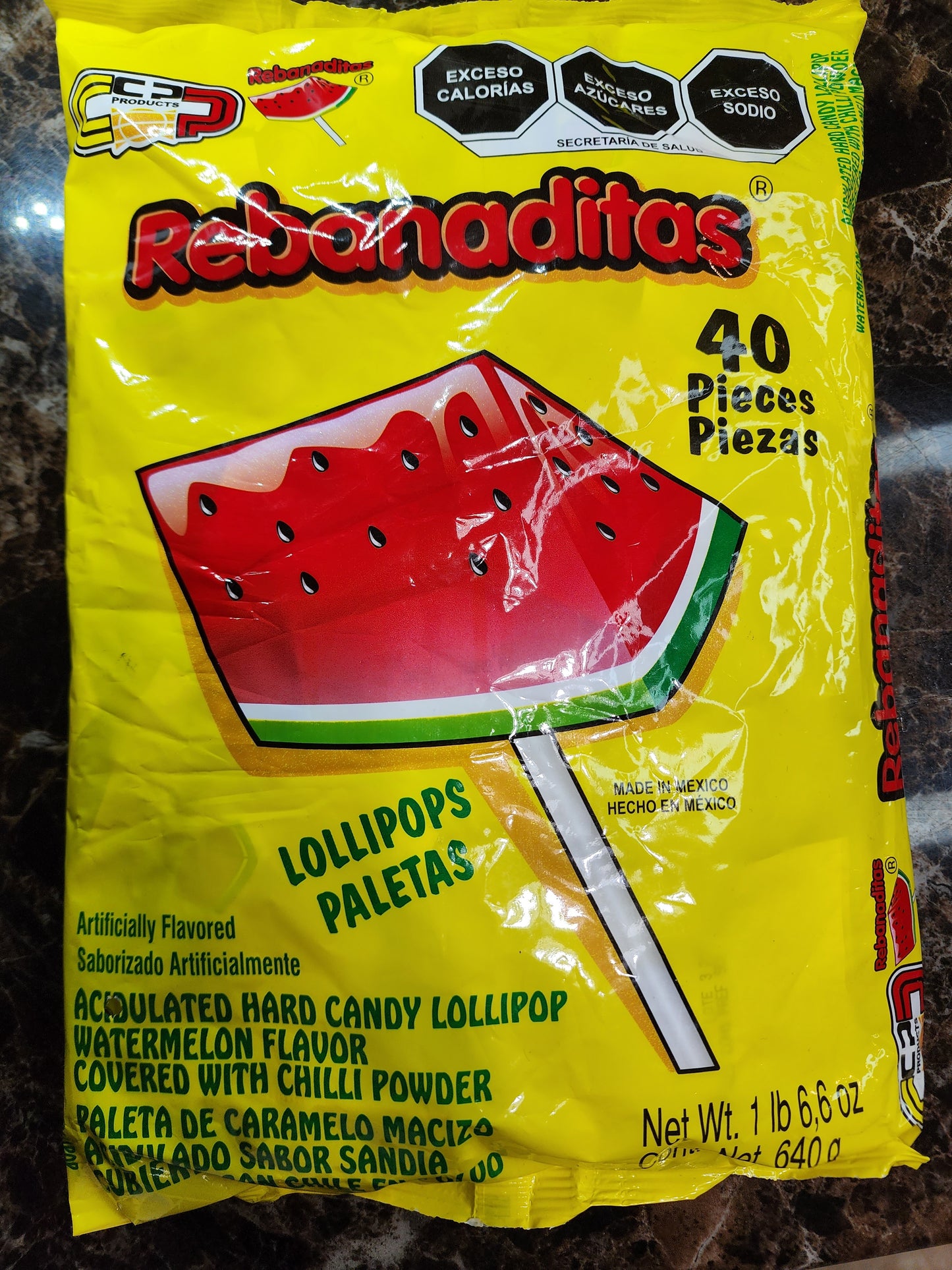 Watermelon lollipops covered with chili powder